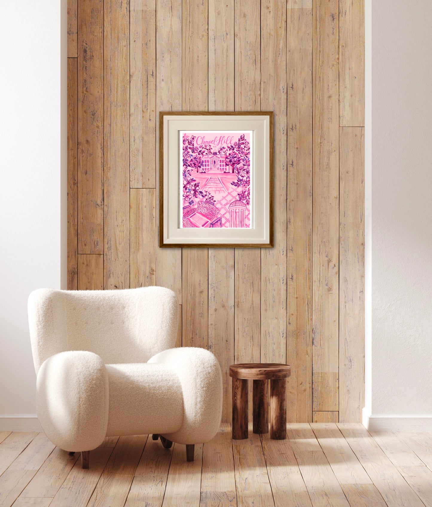 this is a vibrant pink and fuschia floral art print based on a hand painted print. The print is filled with details uniique to chapel hill north carolina. This print is hanging on a wall with a wooden background.