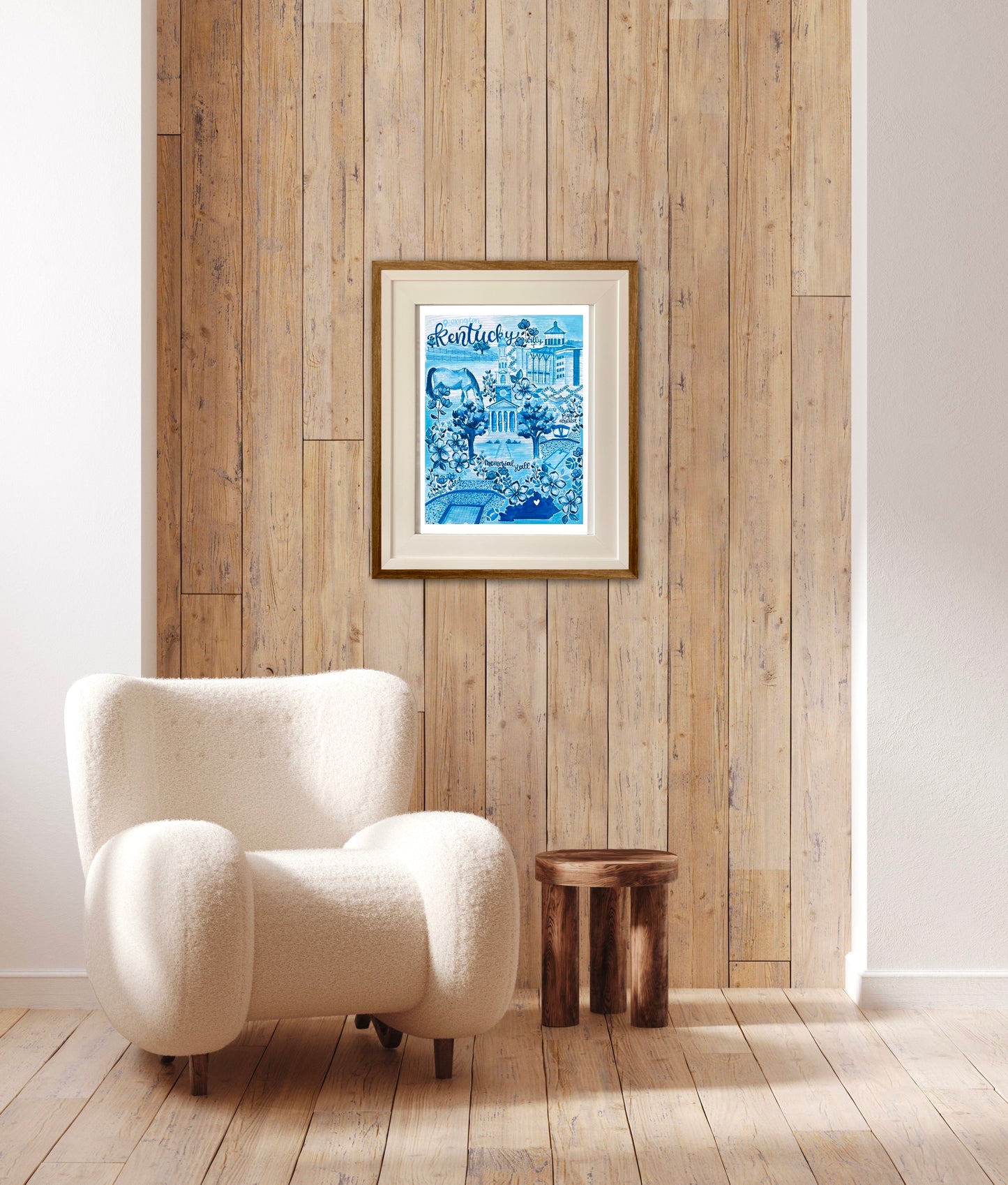 The Lexington, KY toile art print sits in cream mat frame with wood. The artwork is blue filled with floral details, a bright blue state of Kentucky outline, and a watercolor style horse.