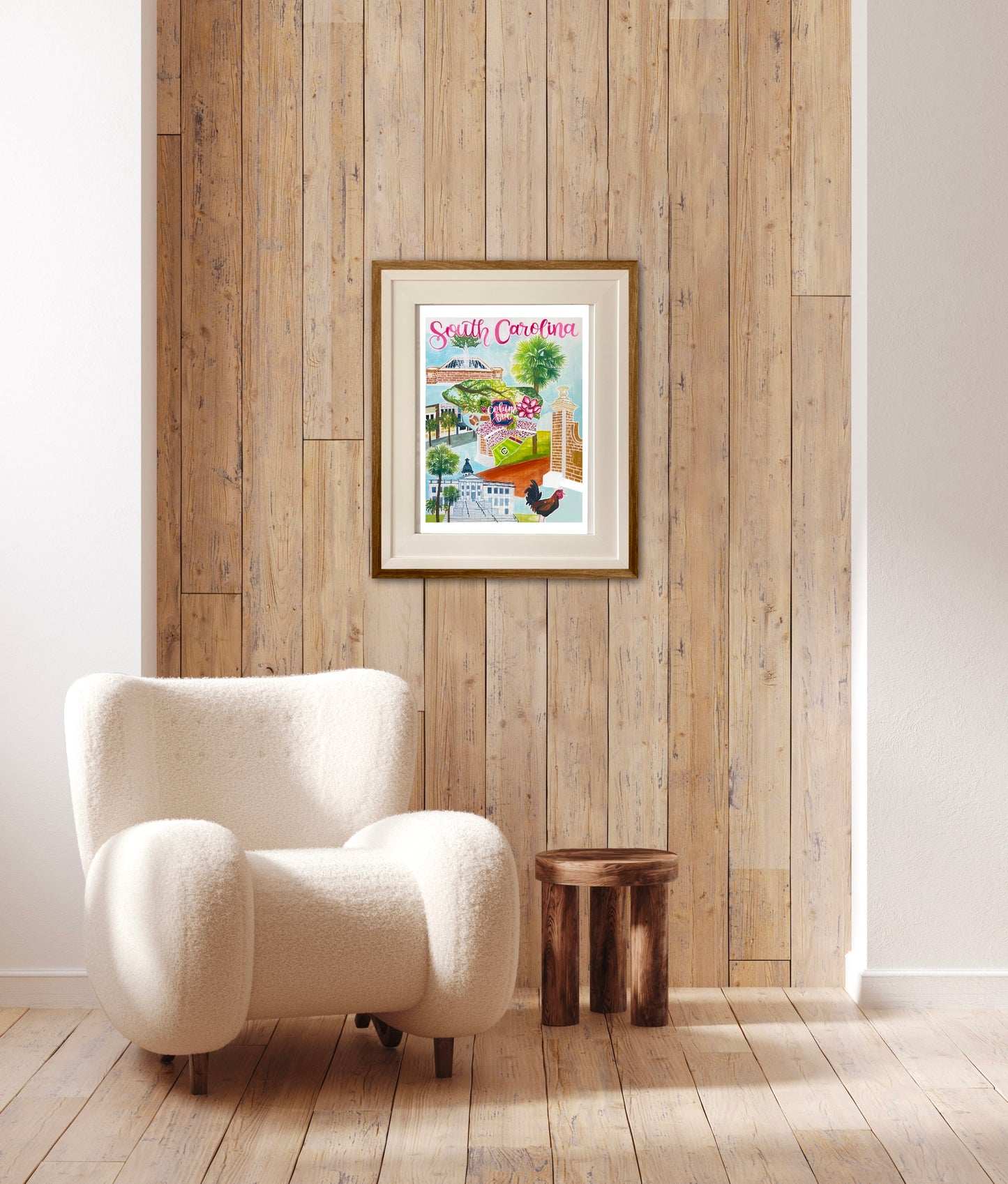 This Vibrant Columbia, Sc print is framed with cream matting a wood. It is backed by a wall of paneled wood and rests above a cozy white chair.